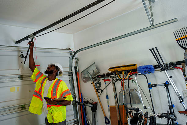 Professional Garage Door Spring Repair technician working in East Jordan, MI